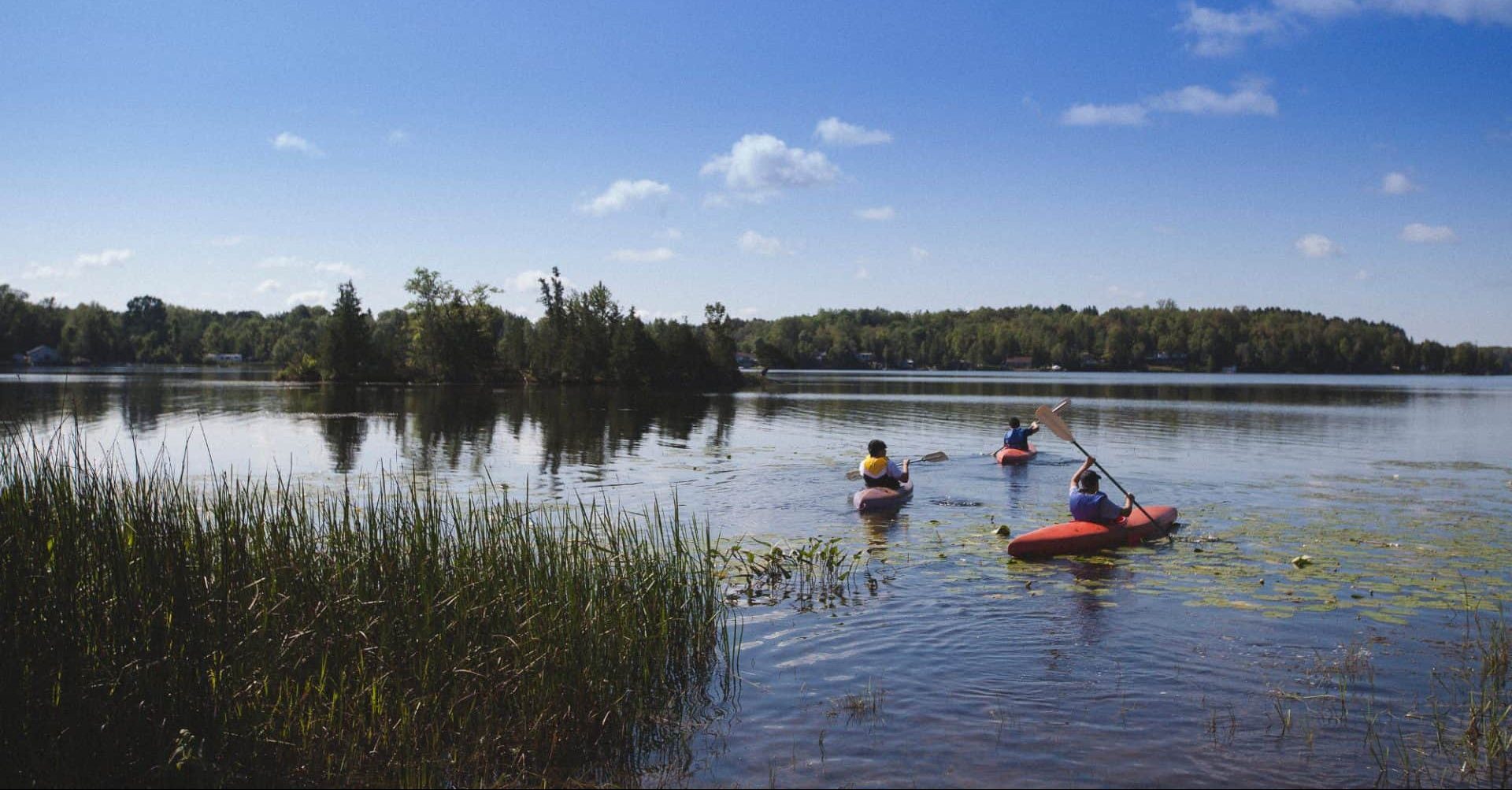 kids Kayaking on the lake at circle square ranch summer camp